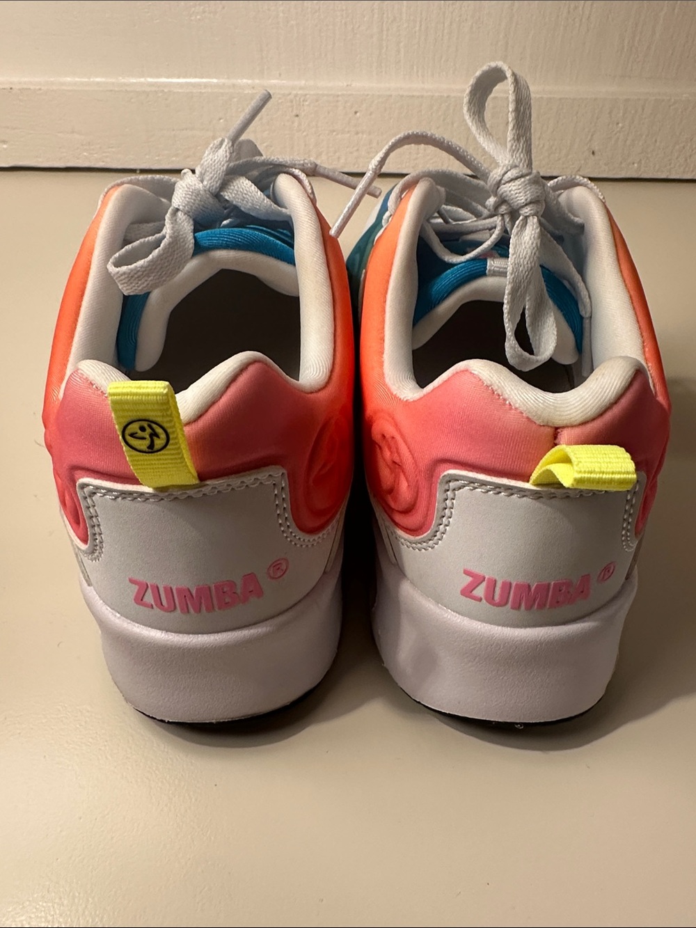 Zumba Fitness White Shoes with Pink-Orange Gradient and Yellow Tabs